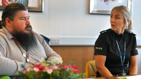 West Mercia Police A trader speaks to West Mercia Police Insp Claire Greenaway