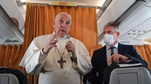 EPA Pope Francis speaking to reporters on a plane