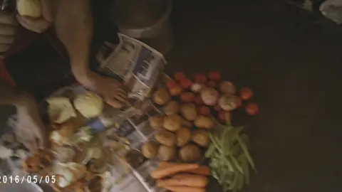 Nick Dunn  Man peels potatoes