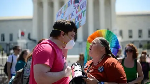 Getty Images Pro- and anti-abortion activists debate outside US Supreme Court