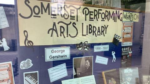A display in the window of Somerset's performing arts library