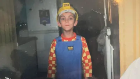 Naomi Lewis Justin Lewis as a child dressed as Bob the builder