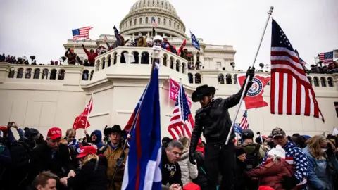 Getty Images A mob of rioters storms the US Capitol on January 6, 2021