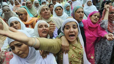 AFP Kashmiri women mourn and shout anti-India slogans at the funeral of Umar Qayoom, 13, in Srinagar August 25, 2010