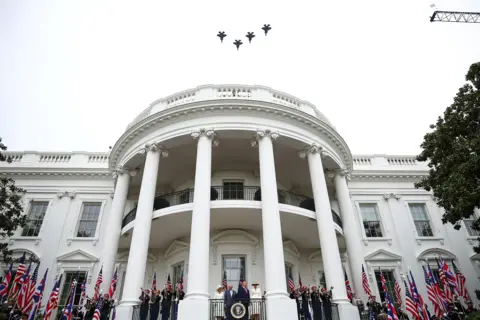 Getty Images  US President Donald Trump, First Lady Melania Trump, King Charles III and Queen Camilla watch a flyover of military planes during an arrival ceremony on the South Lawn of the White House on day two of the State Visit of King Charles III and Queen Camilla to the United States of America, on April 28, 2026 in Washington, DC. 