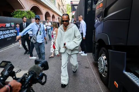 Getty Images Lewis Hamilton pictured in the paddock at the Monaco Grand Prix in 2025 wearing a matching outfit.