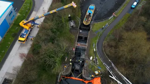 Canal & River Trust Aerial view of ongoing work on the Sheffield and Tinsley Canal, with scaffolding across the site and a crane to the left.