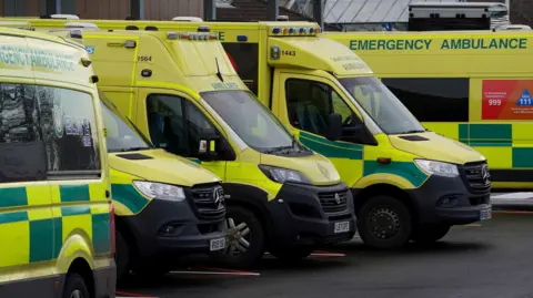 PA Media Ambulances wait outside the William Harvey Hospital