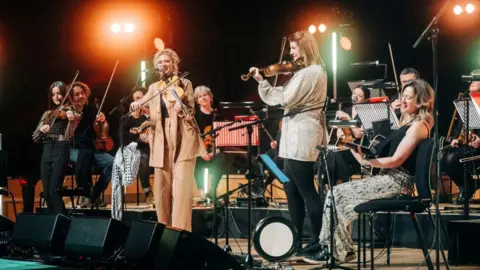 Kris Kesiak Musicians play on stage during the opening night of Celtic Connections 