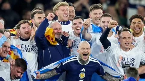 Steve Clarke celebrates with his Scotland players 