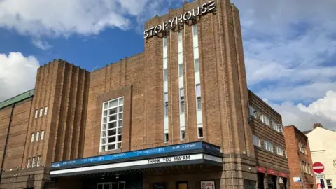 A brown brick building with the words Storyhouse in white letters at the top