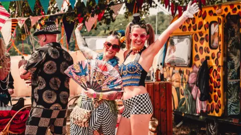 Louisa Mae Photography Colourful outfits on two people posing for a picture