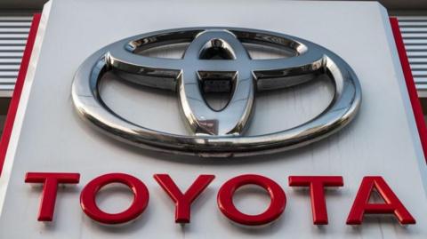 A sign for Japan's Toyota Motor is displayed at a dealership in Tokyo.