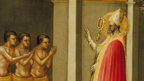 Getty A close-up of Saint Nicholas Resuscitating Three Youths, 1433-35. Artist Bicci di Lorenzo. On the left are three young men with naked torsos, emerging from a barrel each with their hands uplifted. On the right, is a bearded St Nicholas wearing a bishop's mitre, with a halo around his head in a red and gold robe and with his right hand upraised and his left is holding a gold crozier.