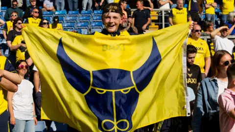  Oxford United fans after the Sky Bet Championship match between Oxford United and Sheffield Wednesday at Kassam Stadium on April 25, 2026 in Oxford, England.