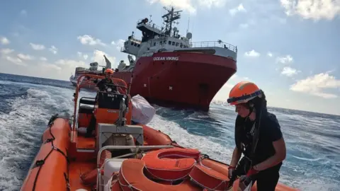 One of the Ocean Viking rib boats pictured in front of the ship