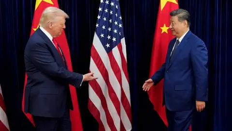 Donald Trump and Xi Jinping shake hands in front of American and Chinese flags
