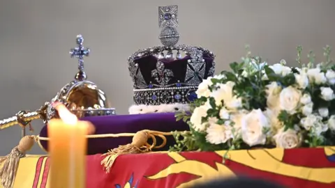 PA Media The Imperial State Crown rests on top of the Queen's coffin in Westminster Hall