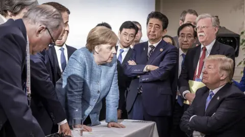 EPA Trump surrounded by other world leaders at the G8 summit in Canada in 2018