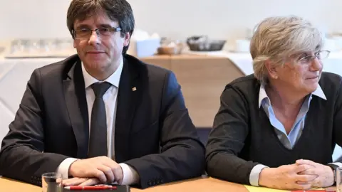 AFP/Getty Images Former Catalan leader Carles Puigdemont and Prof Ponsati in Brussels