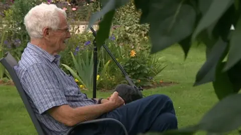 Man sitting in a garden