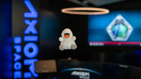 Axiom Space The image of Joy, a small, white toy swan that would be the "the fifth crew member" on Axiom 4