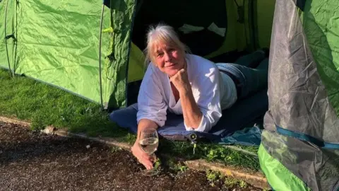 OneWomanAndHisDog Instagram Ms Saker in a tent