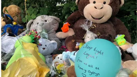 Teddies and balloons left in memory of the little boy