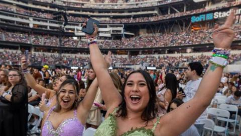 Fans rally before Taylor Swift performs during The Eras Tour at SoFi Stadium in Inglewood