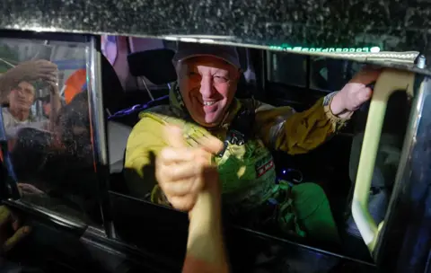 Alexander Ermochenko/Reuters Wagner mercenary chief Yevgeny Prigozhin leaves the headquarters of the Southern Military District