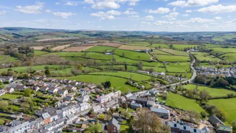 Getty Images Houses along a main road and other residential areas on the edge of South Molton going out into a patchwork of fields.