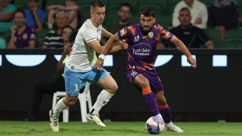 Johnny Koutroumbis (right) in action for Perth Glory