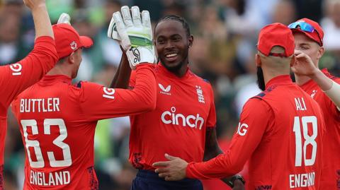 Jofra Archer celebrates with his England team-mates after taking a wicket in T20 against Pakistan