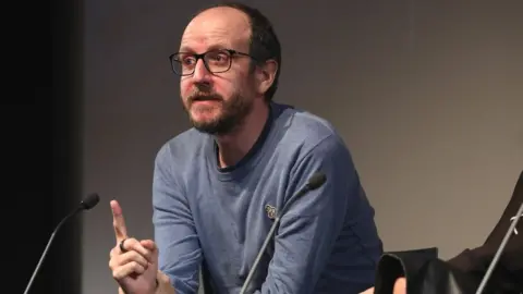 Getty Images Bafta-winning writer Jack Thorne speaking on stage