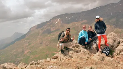 BBC  Amy, Kavout and their guides climbing Halgurd, shortly after wandering across an uncleared minefield