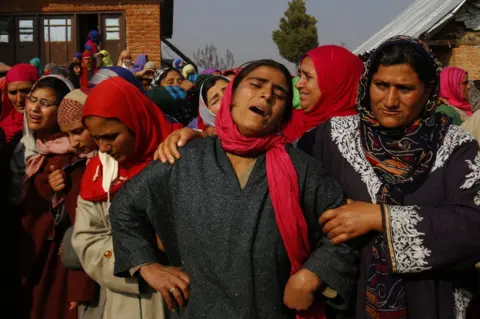 Abid Bhat A Kashmiri Muslim woman wails during the funeral of local policeman, Adil Ahmad, on 29 August 2018.