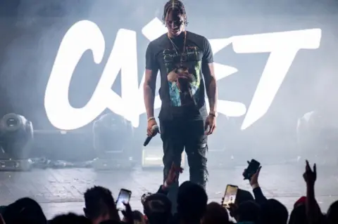 Getty Images Krept on stage at the Rated Legend show