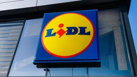A red, yellow and blue sign that reads 'Lidl' 