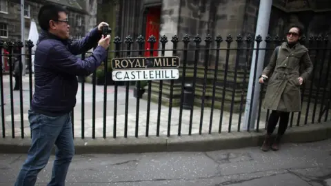 Getty Images Tourists in Edinburgh