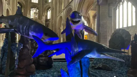  Emma Baugh/BBC Monsters of the sea sculptures inside the cathedral 