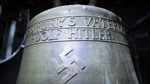 AFP/DPA Picture taken on May 19, 2017 shows a Nazi-era church bell that bears a swastika and the words "All for the Fatherland Adolf Hitler" ("Alles fuer"s Vaterland - Adolf Hitler").