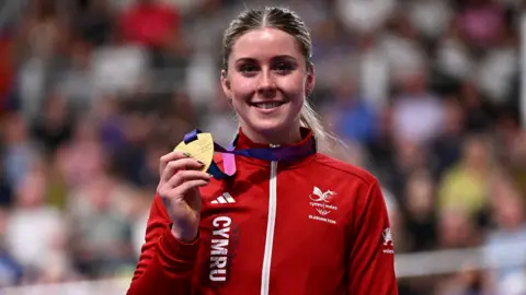 Emma Finuacane holds a Commonwealth Games medal