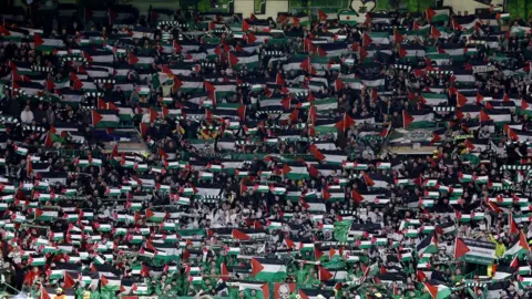 Reuters The stands at Celtic Park were a sea of Palestinian flags shortly before kick off against Atletico Madrid