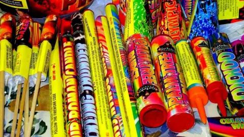  A selection of various home fireworks taken on a table top.