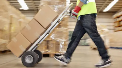 Clerkenwell Man with package for delivery