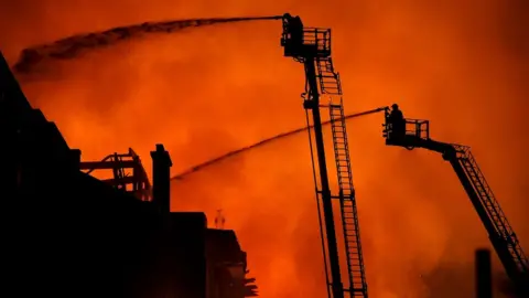 Getty Images Firefighters at the Mack