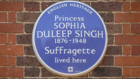 Christopher Ison/English Heritage An image of the blue plaque at Faraday House, describing the princess as a suffragette