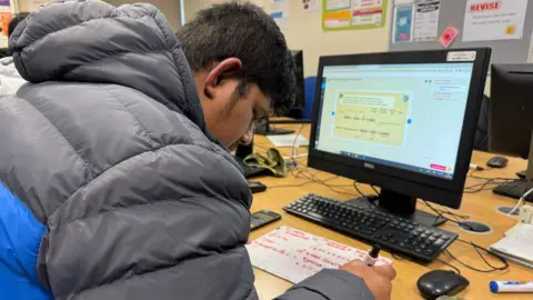 Student working in a maths class