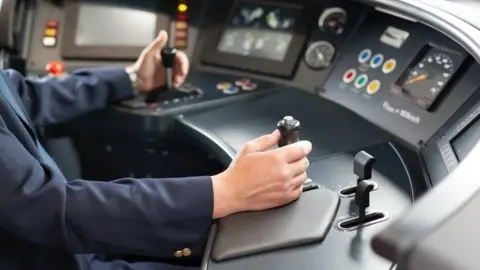 Getty Images Arms of a train driver