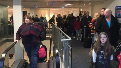 Manx Breast Cancer Support Group Queues at the Isle of Man Airport